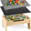 The dual-function wooden children's activity table with storage function, featuring 100 colorful components, tracks, trains, and cars, is a...